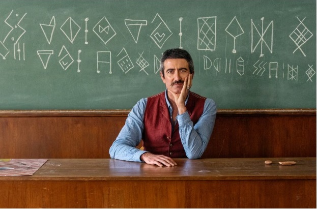 Ancient Linear Elamite script symbols carved on stone, representing early writing systems